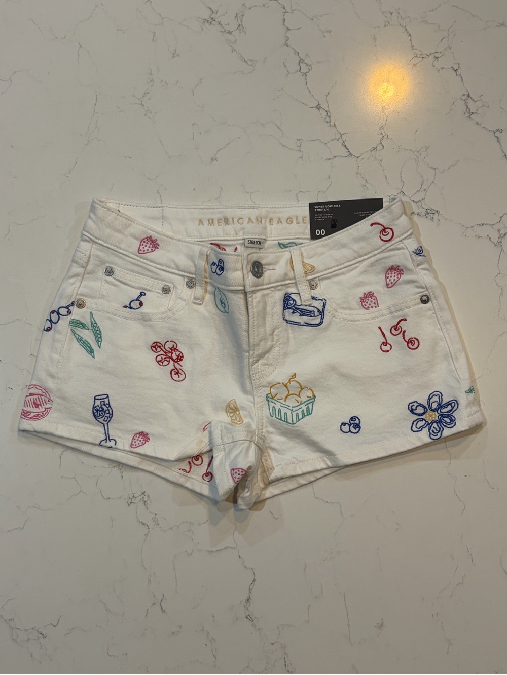 American Eagle Outfitters White Low Waisted Denim Shorts with fruit Embroidery